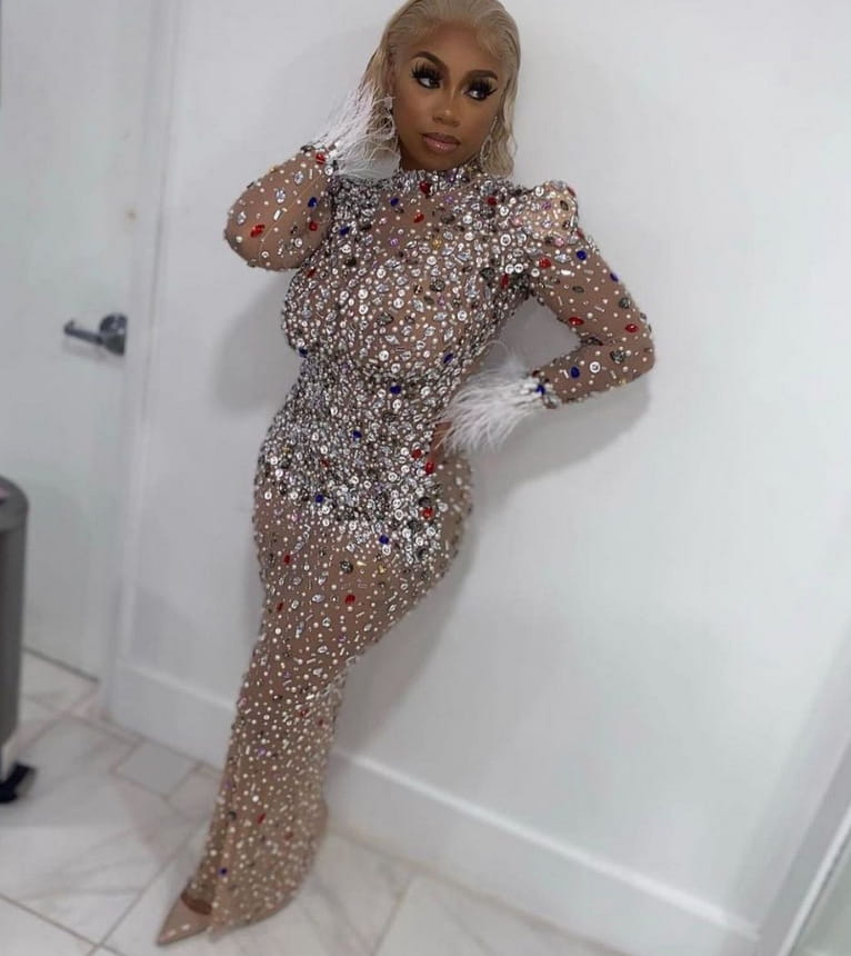 a silver feathered rhinestone mesh stretch slim dress featuring a shimmering long-sleeved bodycon design with sparkling silver sequins and scattered red and blue accents