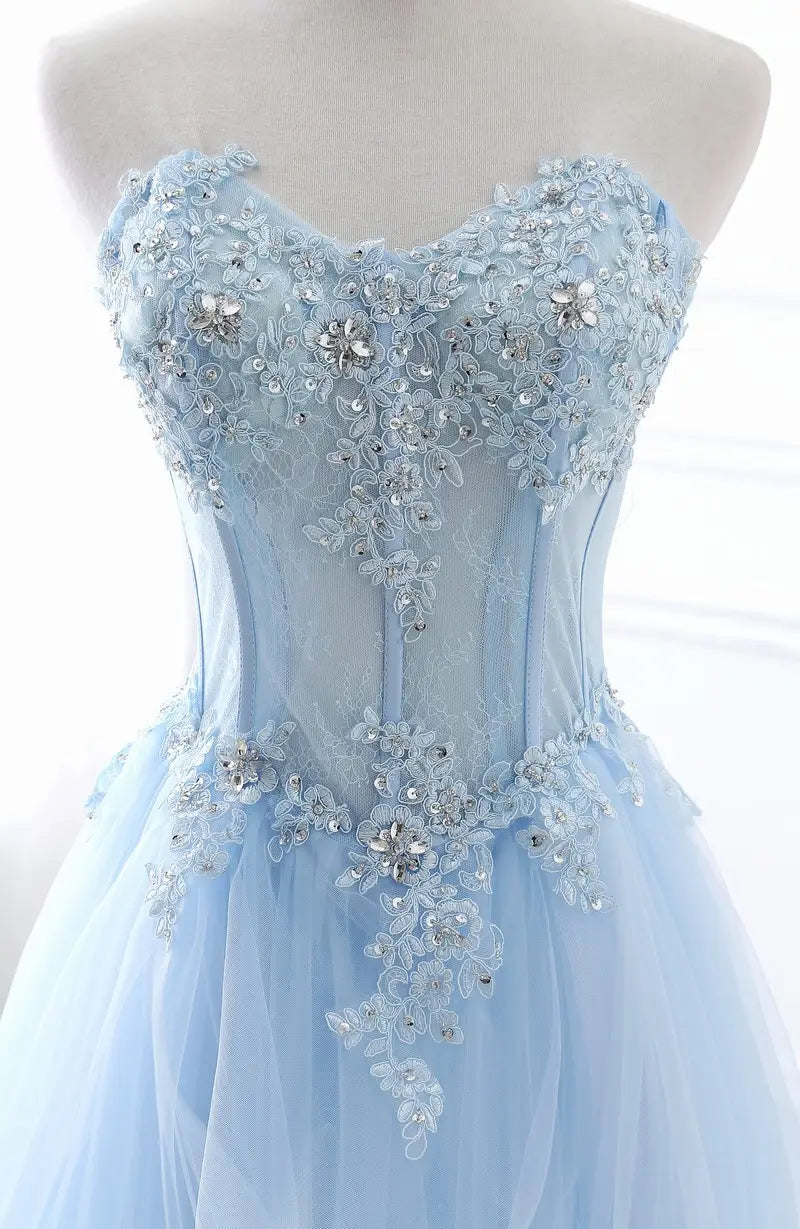 A delicate light blue slim fit bridesmaid gown with intricate lace and silver sparkling beaded floral embellishments suitable for an annual meeting.