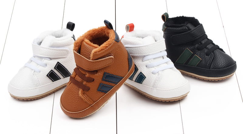 brown leather baby bootie with navy blue stripes and plush fleece lining designed as sports soft-sole cotton baby shoes