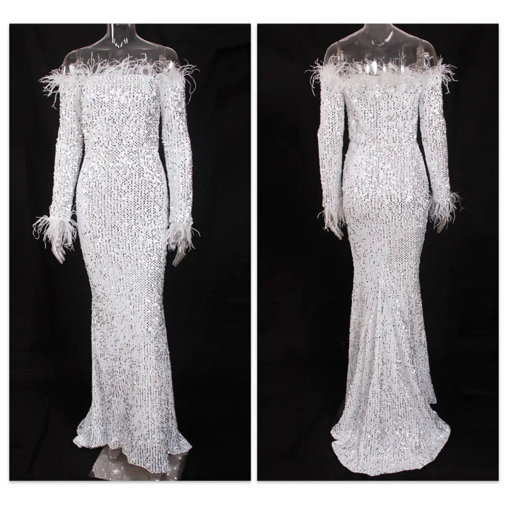 a dazzling white sequined fishtail party formal dress with long sleeves and feathered shoulder accents perfect for elegant events