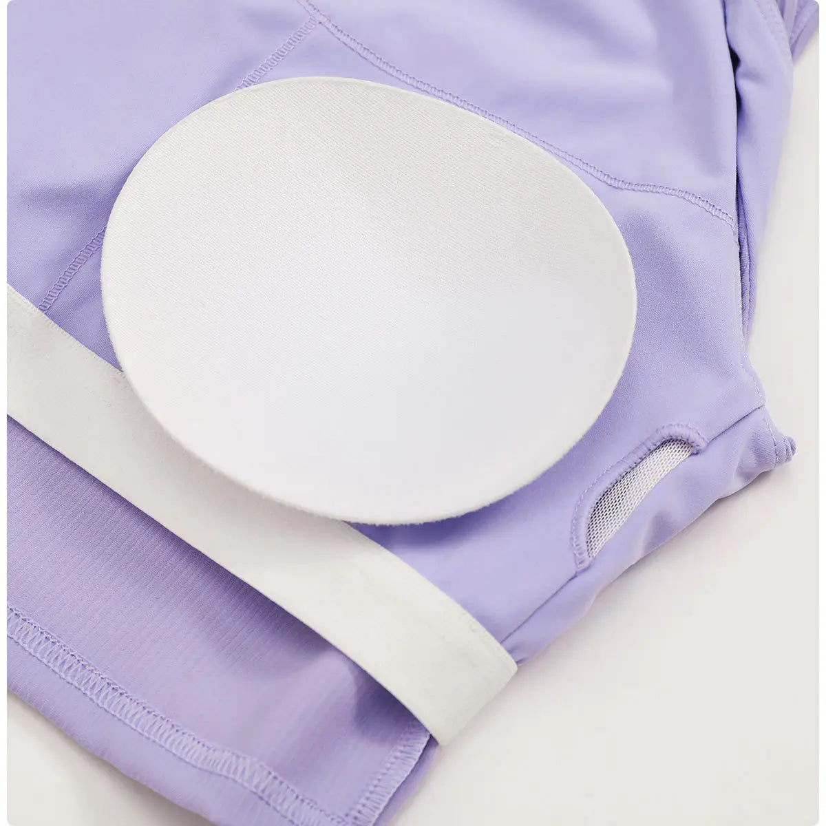 a white circular padded insert on a lavender ribbed quick dry breathable running sports bra designed for optimal comfort during running sports activities