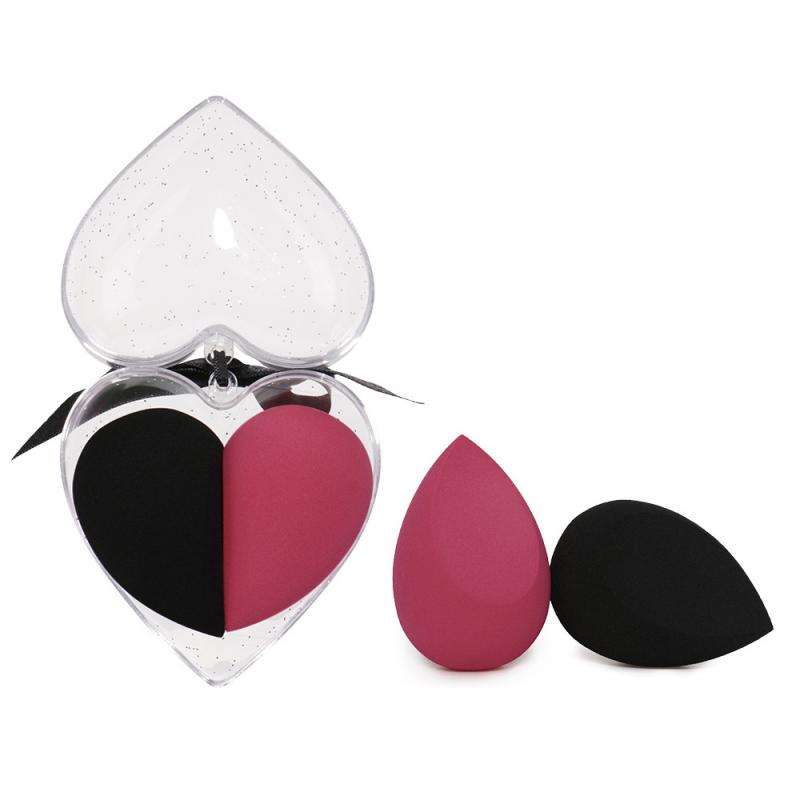 Heart shaped clear case gift box containing black and pink dual sided beauty egg makeup sponge set.