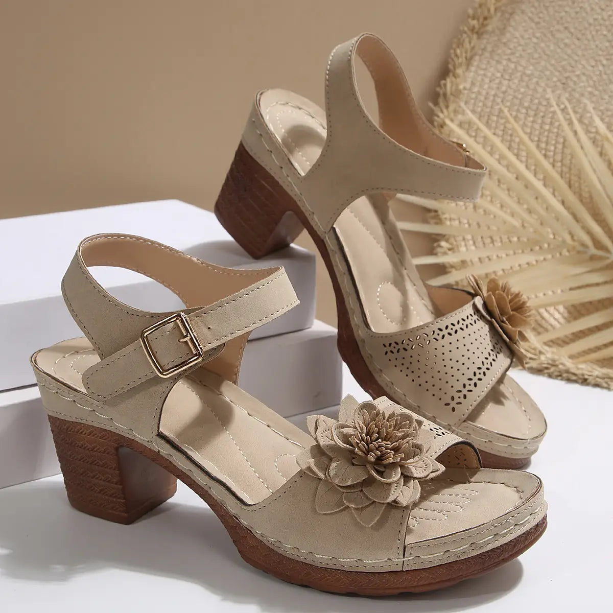 Beige leather chunky heel sandals with floral embellishment and wooden block heels perfect for heel sandals summer.