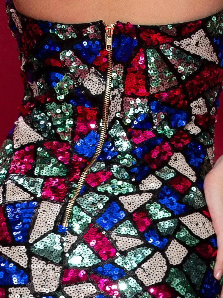 A women sexy v neck off shoulder sequined corset dress featuring a vibrant mosaic pattern of red, blue, green, and silver sequins with a gold zipper down the center.