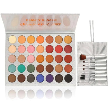 Silver glittery 36 colors eyeshadow palette with vibrant pans and matching 7pcs makeup brushes set for eye makeup