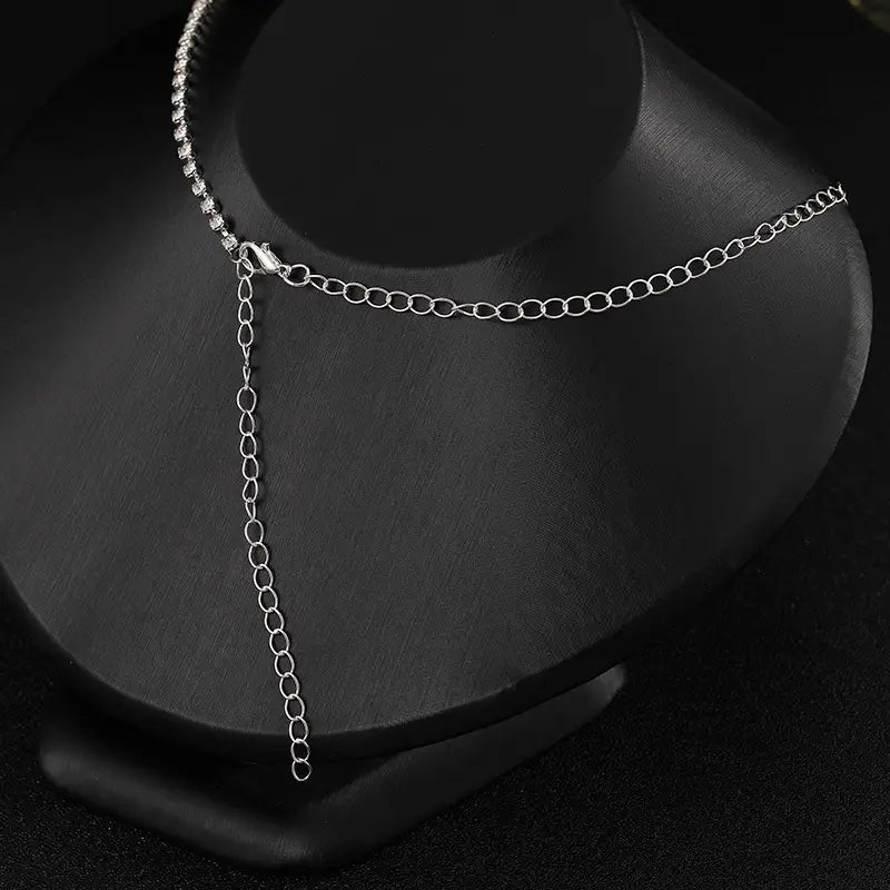 silver chain choker with a delicate beaded edge and adjustable extension in a luxury zircon necklace and earrings set for luxury women’s fashion.
