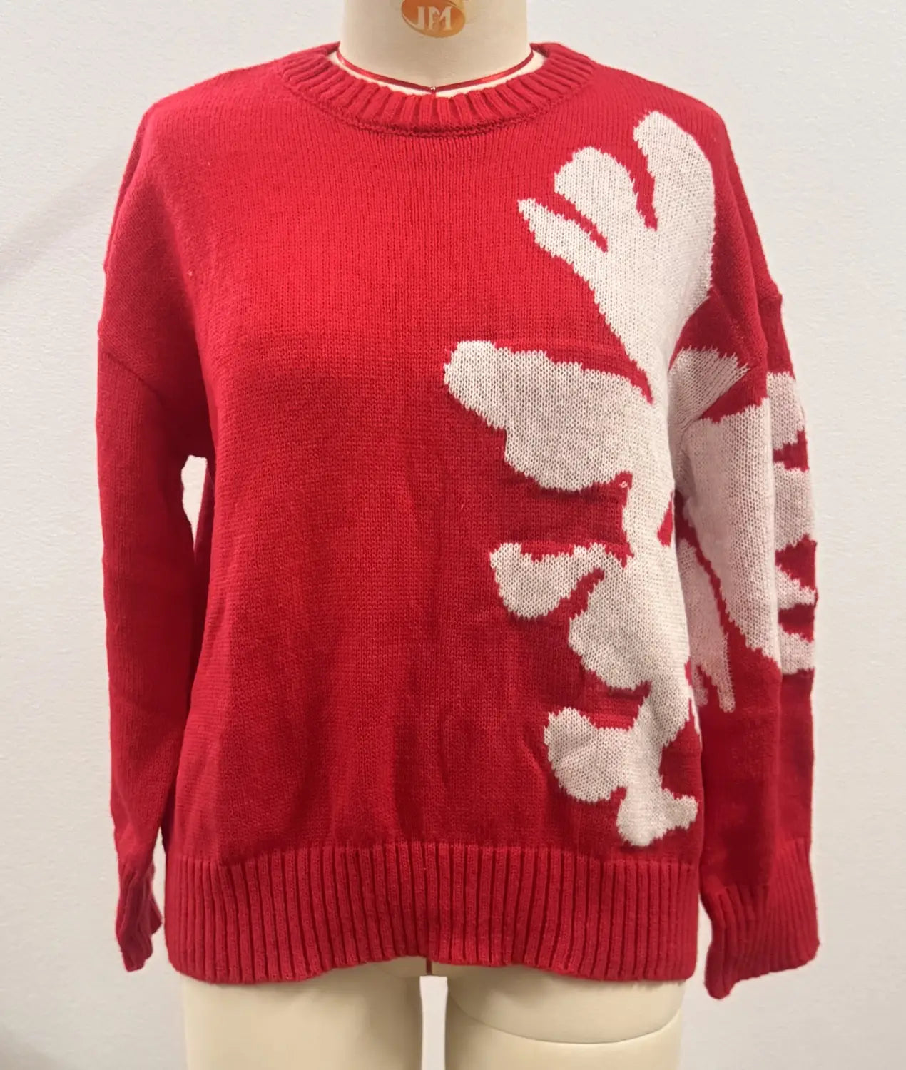 Red knit sweater featuring a large white snowflake 3d floral design with floral contrast color on the front and a contrast color crewneck ideal for Christmas wear.