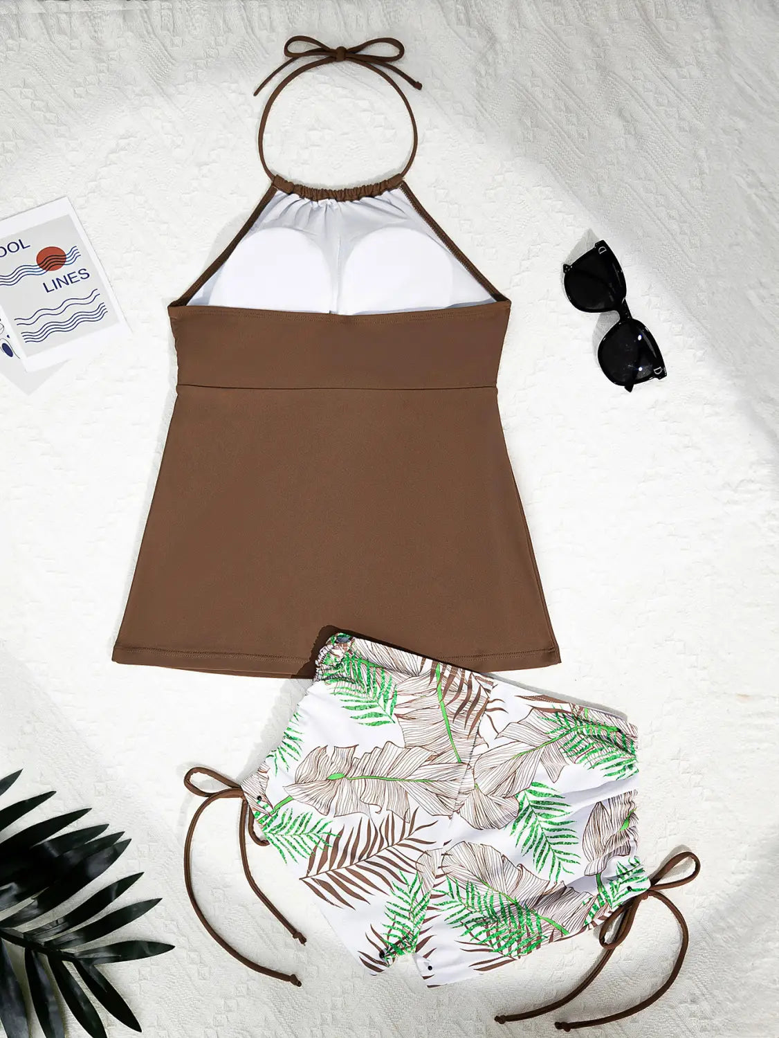 brown halterneck printed halter split swimsuit featuring a brown halter top with white underwire cups and leaf-patterned high-waisted bottoms designed as a printed halter bikini.
