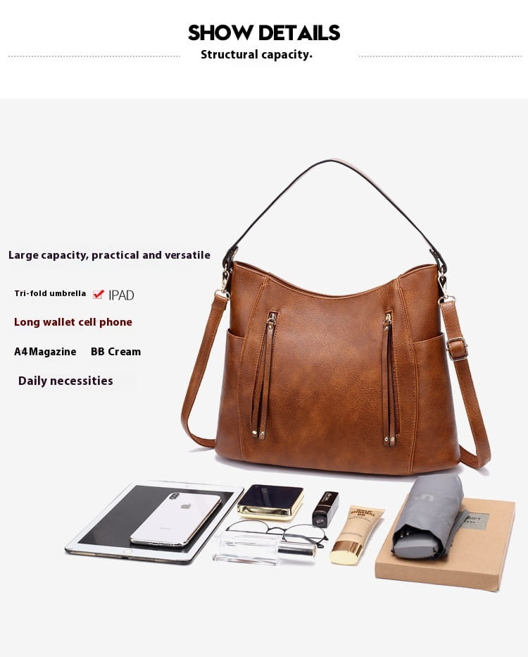 Brown leather luxury women leather hobo bag with large capacity and a structured slouchy design featuring dual shoulder straps.
