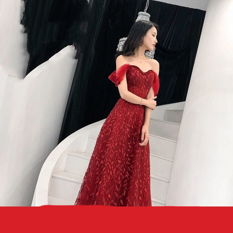 A shimmering red off-the-shoulder lace slim slimming bridal evening dress with intricate sequin embroidery and delicate ruffled sleeves.
