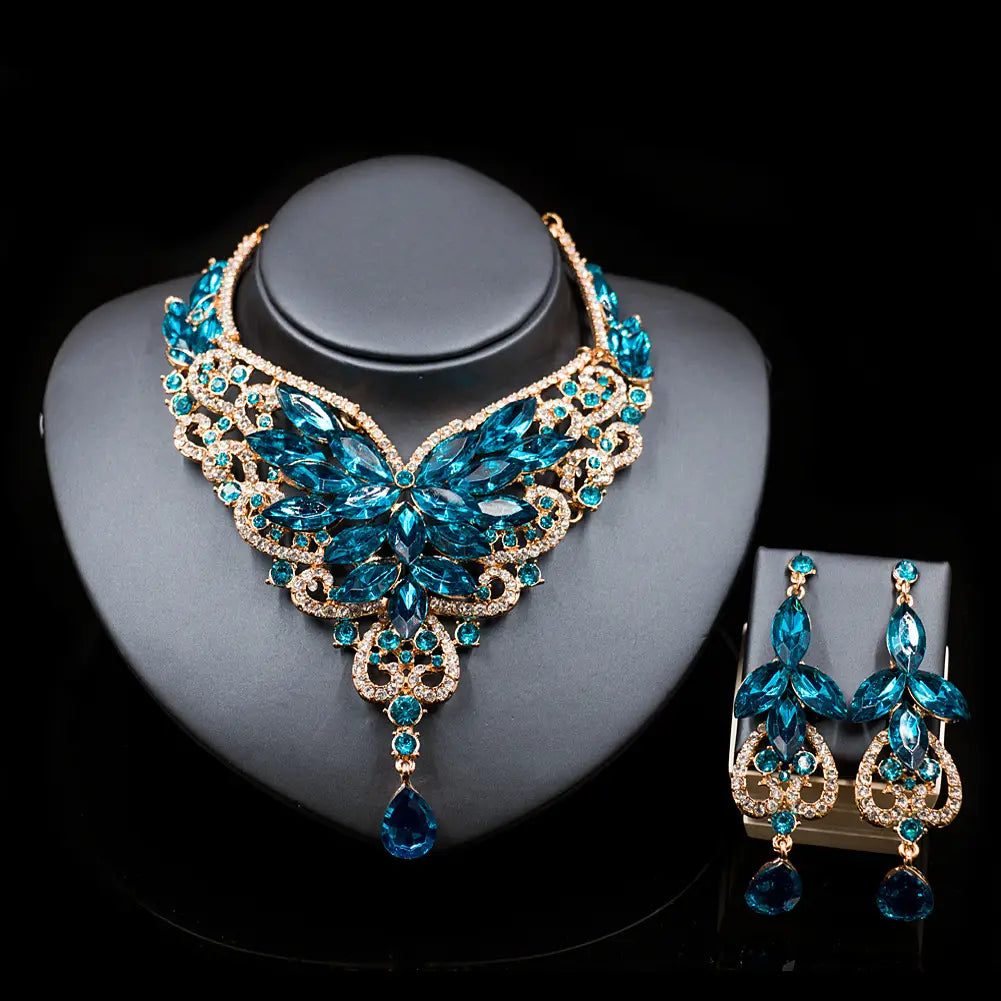 a dazzling turquoise and gold crystal choker necklace with matching earrings featuring intricate leaf-like designs and dangling teardrop pendants from the american color exaggerated bride jewelry set ideal for a speed selling explosion in bridal color exaggerated fashion.