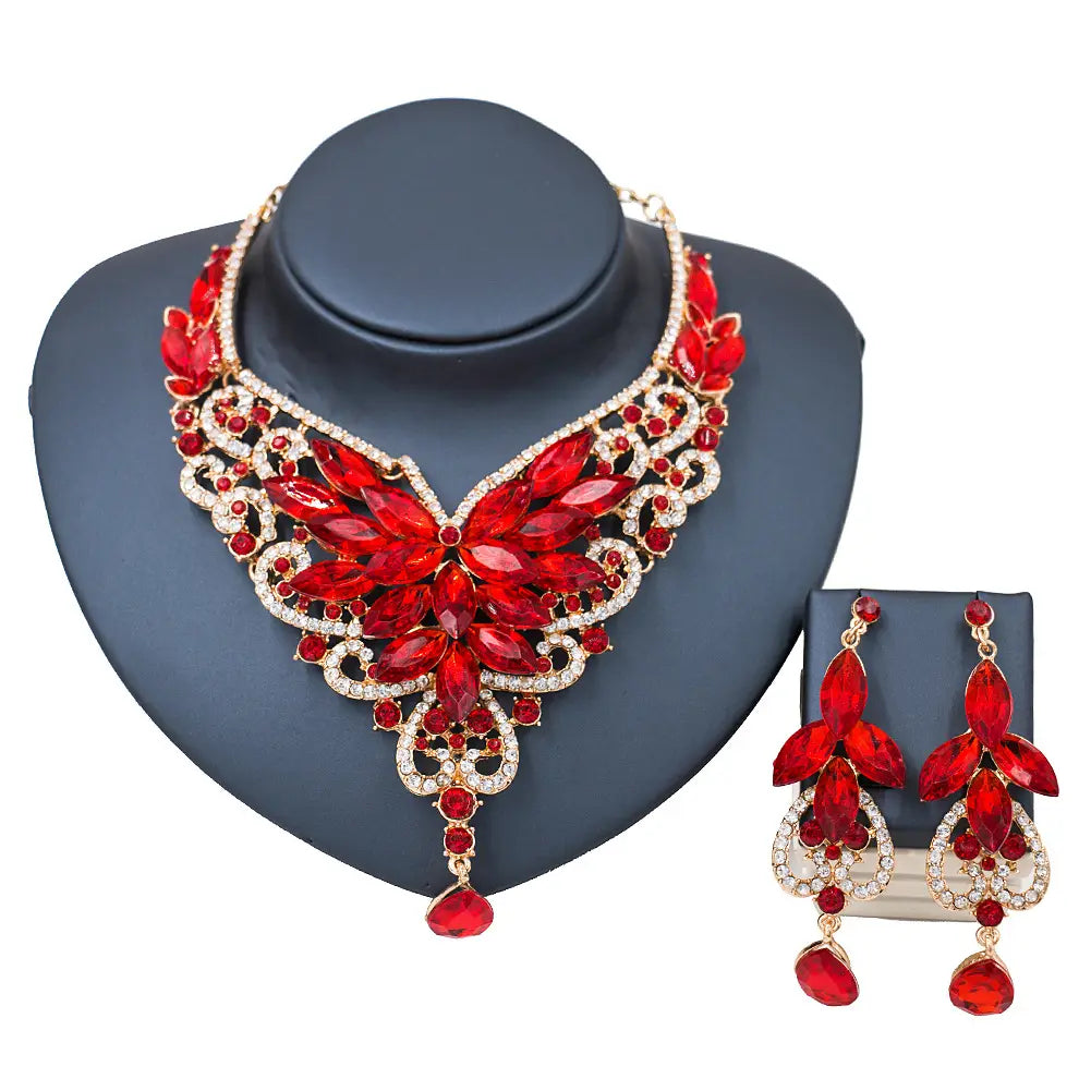 American color exaggerated bride jewelry set featuring a red and gold floral-themed statement necklace with large red crystals and clear stones paired with matching drop earrings ideal for speed selling explosion.