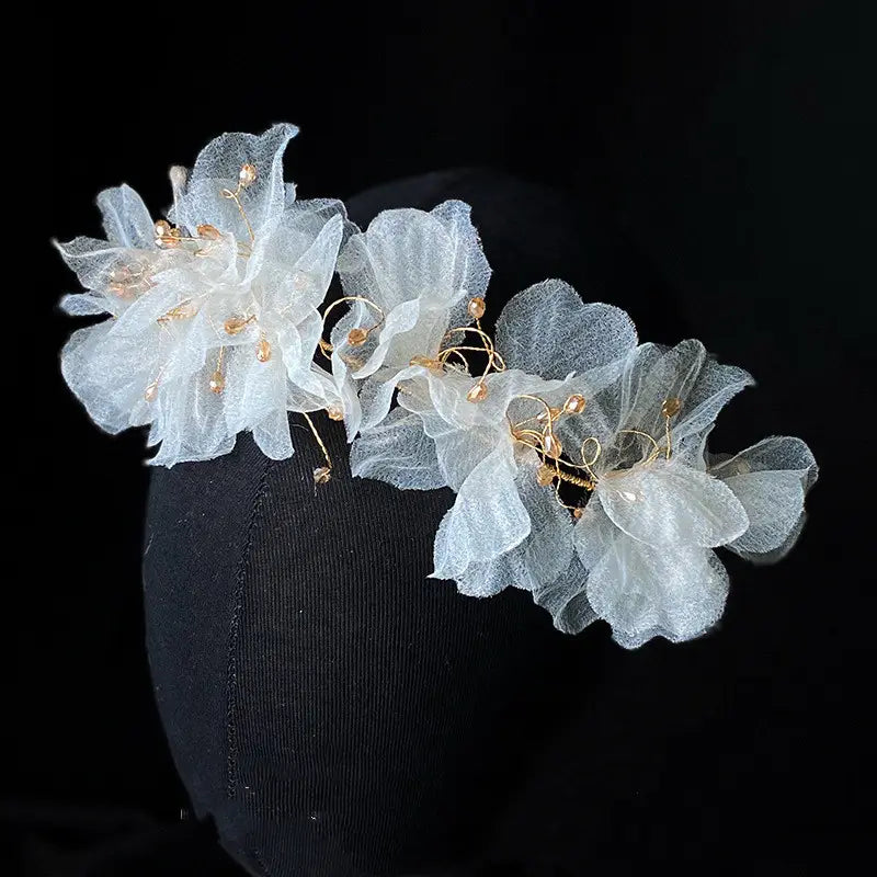 Delicate white organza tulle flower headband earring set adorned with gold wire and tiny beads.