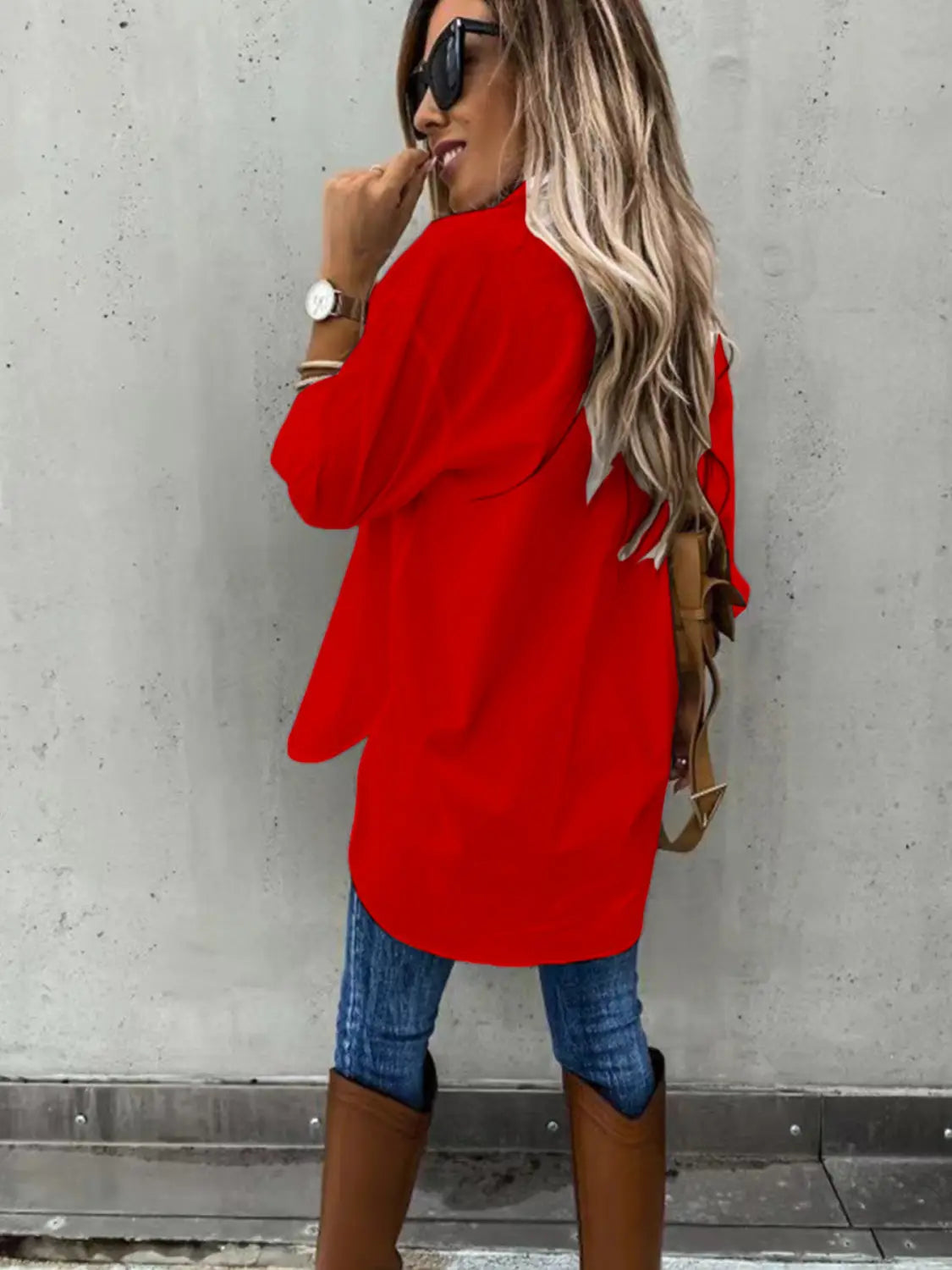 A vibrant red long sleeve lapel button down shirt featuring a loose long sleeve design and a slightly flared hem.