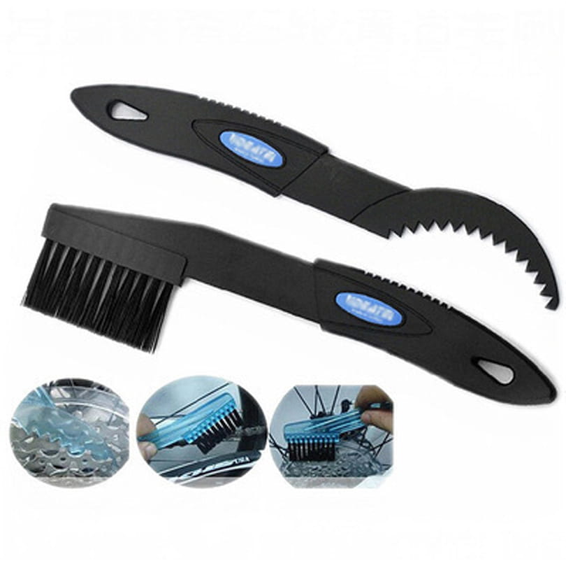 Black plastic bicycle cleaning tool set featuring a large bristle brush and serrated scraper for effective chain maintenance.