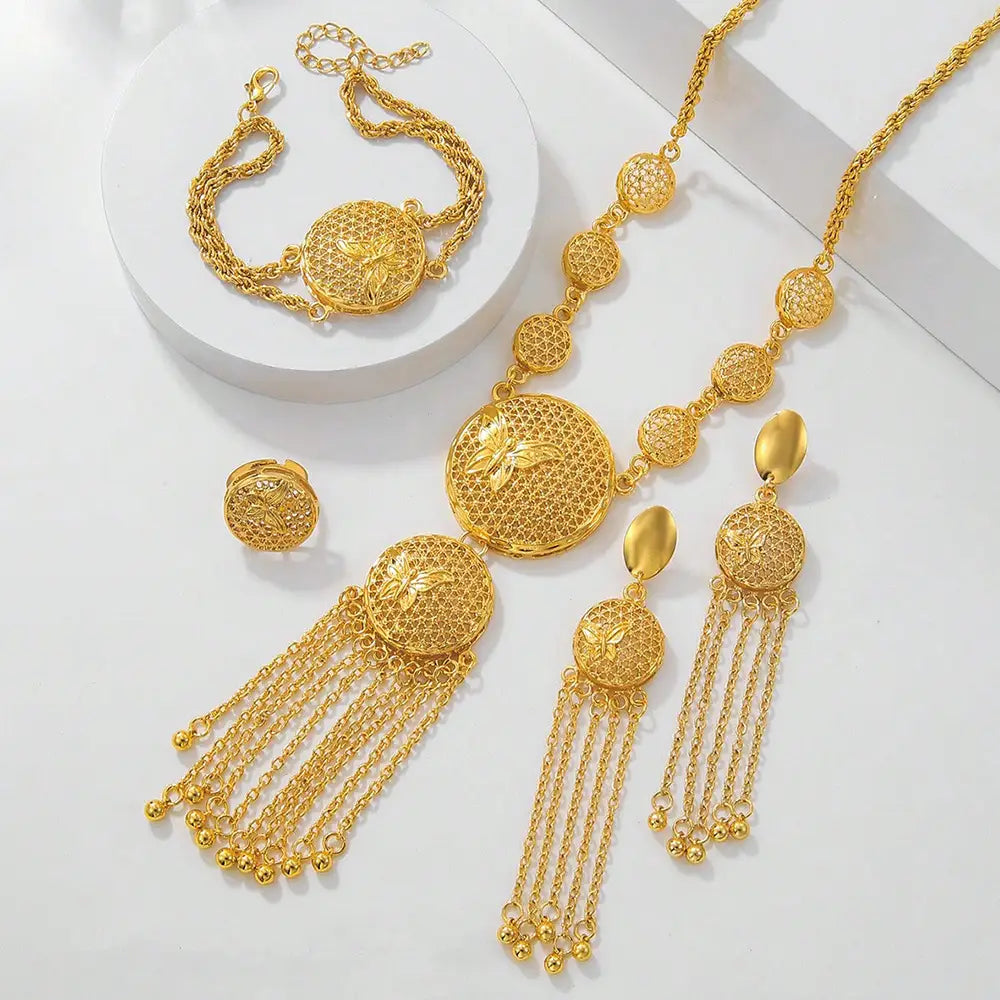 Gorgeous butterfly middle ring set featuring golden butterfly-themed jewelry with intricate filigree detailing and dangling chain tassels designed as a wedding decoration necklace.