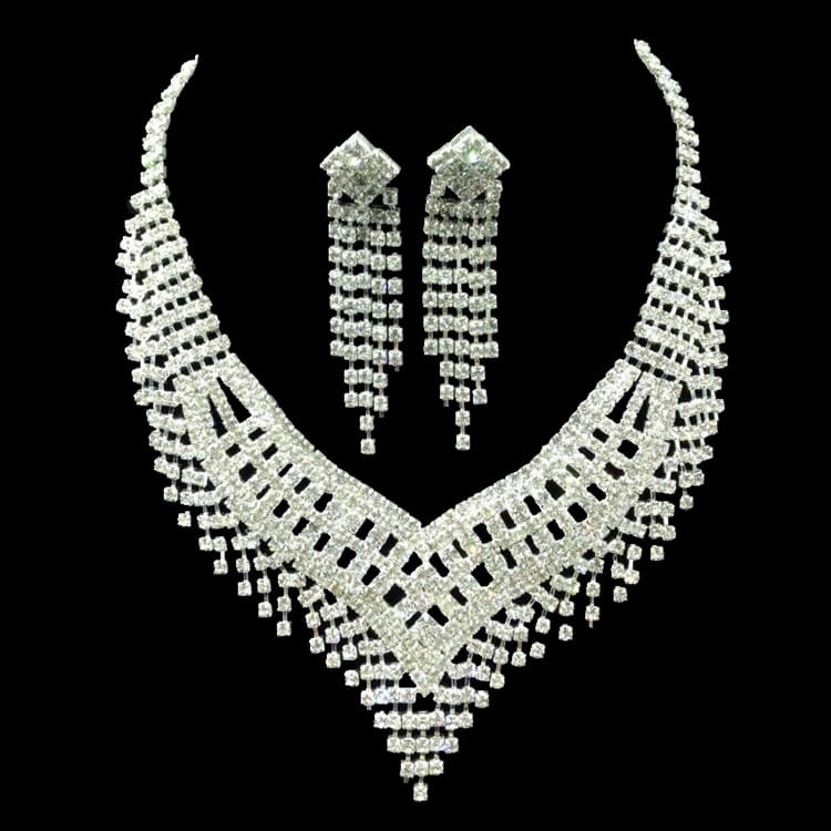 a dazzling silver-toned crystal choker necklace with cascading rhinestone tiers and matching drop earrings featuring a geometric lattice design in american rhinestone claw chain large style