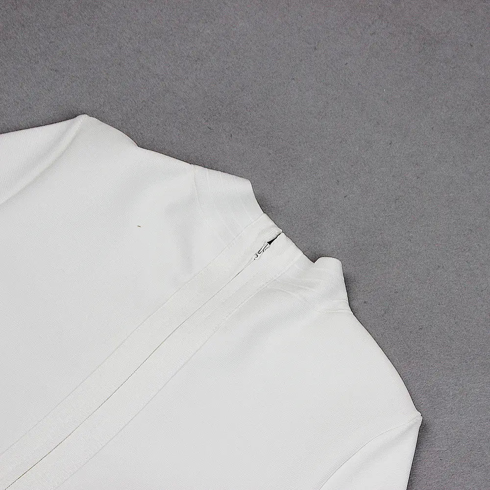 a crisp white blazer with a structured collar and clean tailored seams paired with a white high neck chest scheming hip short skirt