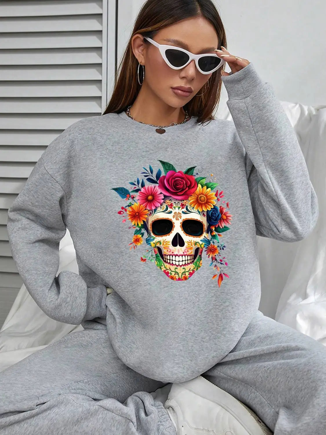 Gray crew neck sweatshirt for daily wear featuring a vibrant colorful floral skull design and basic long sleeve style.