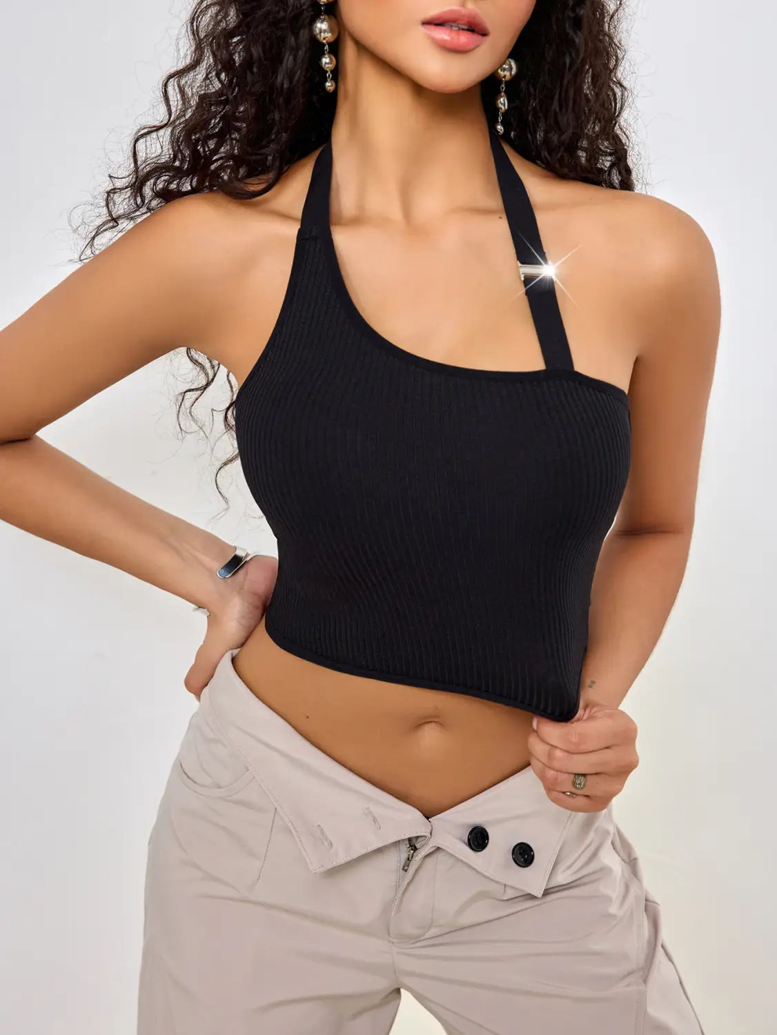 black ribbed solid color low cut one shoulder vest featuring a sleeveless low cut cropped fit halter top design