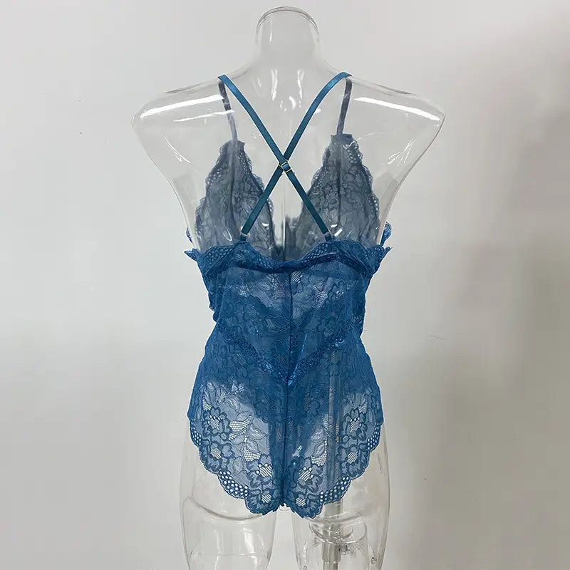 blue lace sleeveless halter plus bodysuit with crisscross back straps featuring white floral lace detailing in halter plus size design