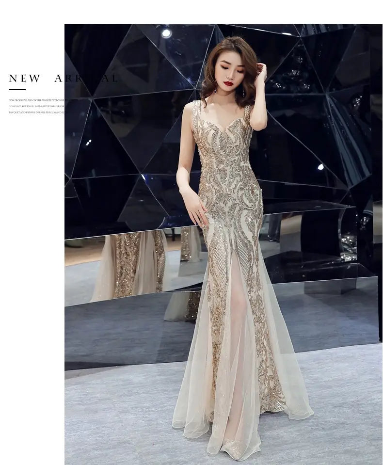 A shimmering gold and cream mermaid-style black fishtail long summer dress adorned with intricate beaded embroidery and summer sequins sling design.