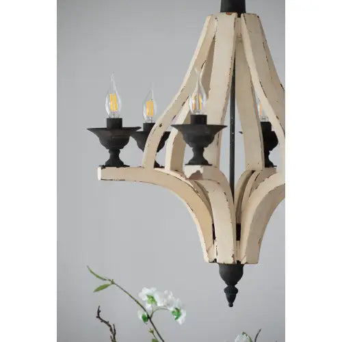 Antique-style 6 light wood chandelier with distressed cream finish and black metal accents featuring four candle-shaped bulbs for dining hall entrance.