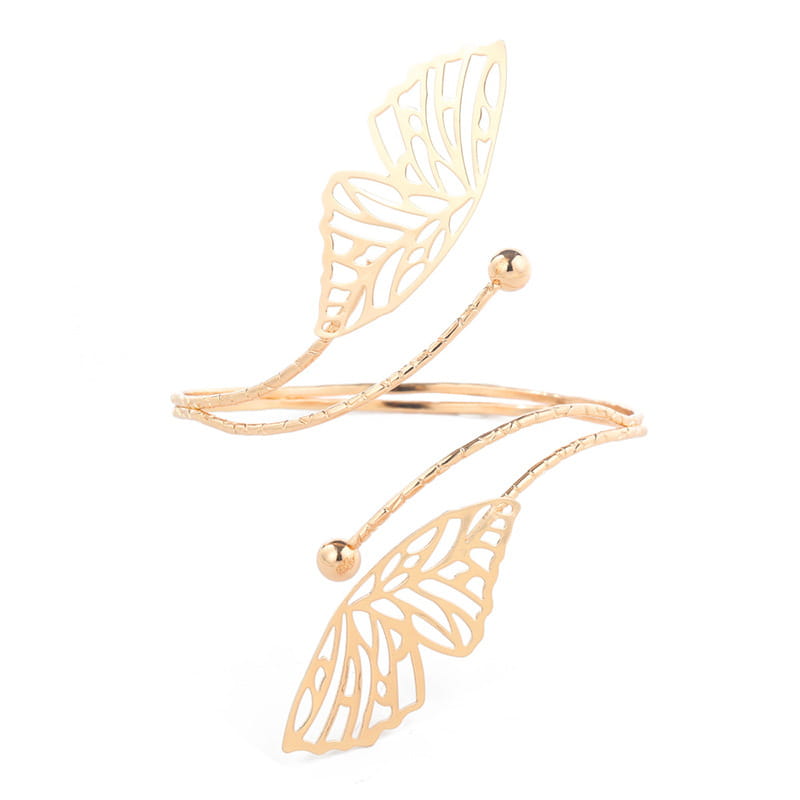 gold-toned butterfly wing cuff bracelet with intricate cut-out detailing and small spherical accents exemplifies fashion personality trend and simple trend body accessory.