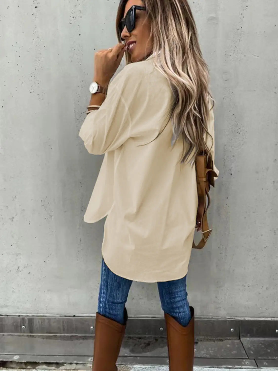 beige oversized long sleeve shirt with a relaxed fit and slightly curved hem, designed as a loose long sleeve lapel button down shirt.