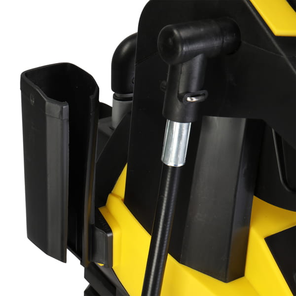 Black plastic holster mounted on the side of a yellow high pressure cleaning machine with hose reel for efficient pressure cleaning tasks.