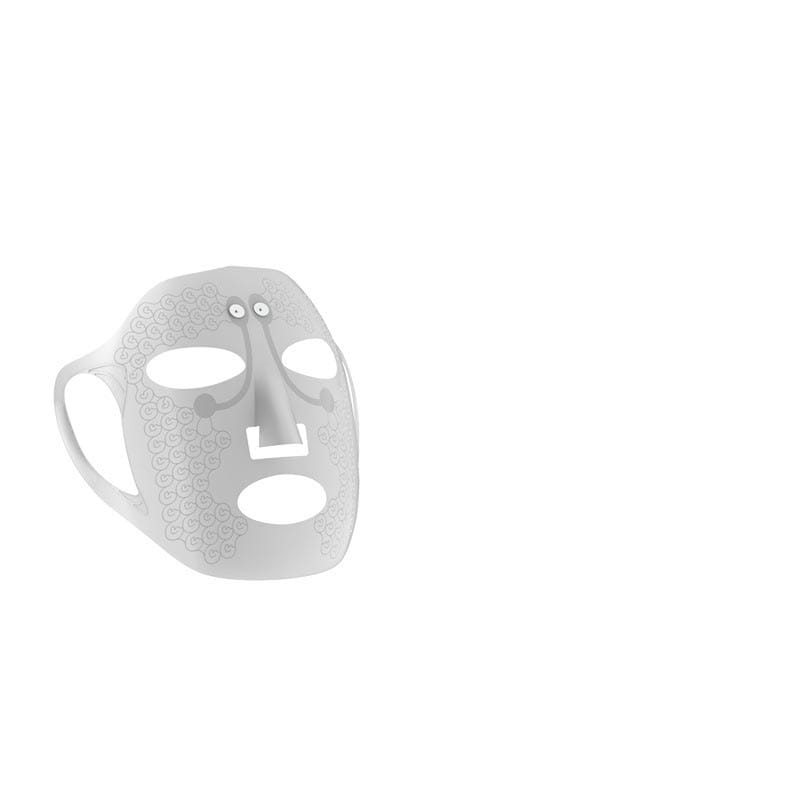 A sleek silver-toned lace pattern electric facial massage mask with a stylized face design featuring cut-out eyes and mouth for effective facial massage.