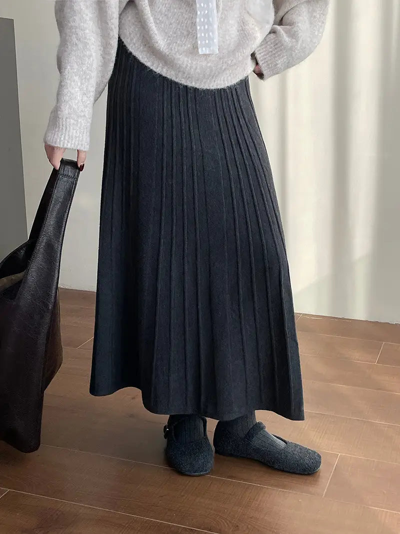 a dark gray korean elastic waist knitted pleated midi skirt made of soft textured knit fabric