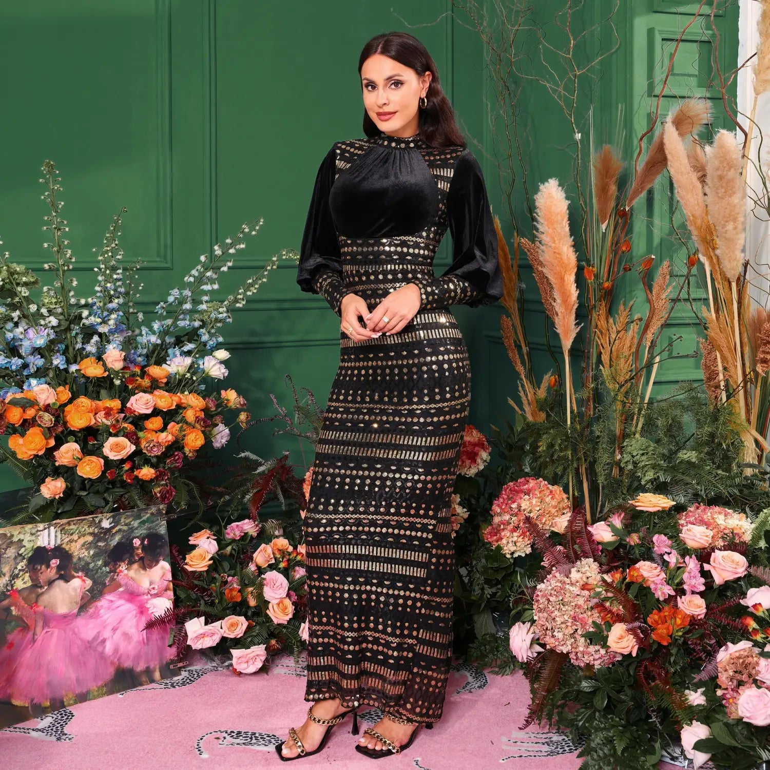 black velvet and sequined long sleeve round neck maxi dress with intricate gold-toned embellishments on the bodice and skirt