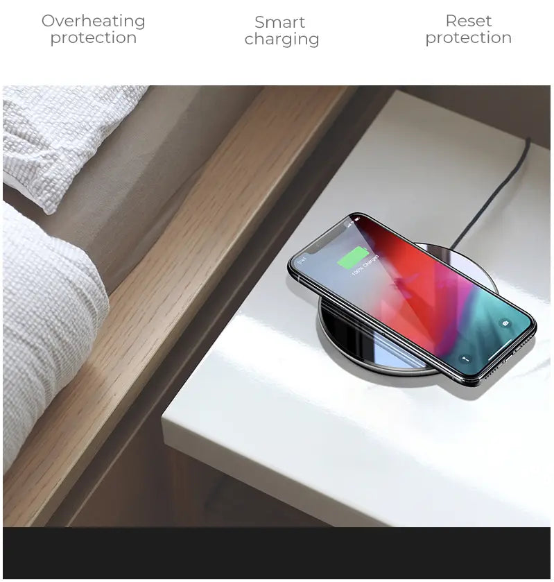 a sleek black glossy wireless charger smooth 15w with a circular design, reflective surface, and silver rim for efficient wireless charging