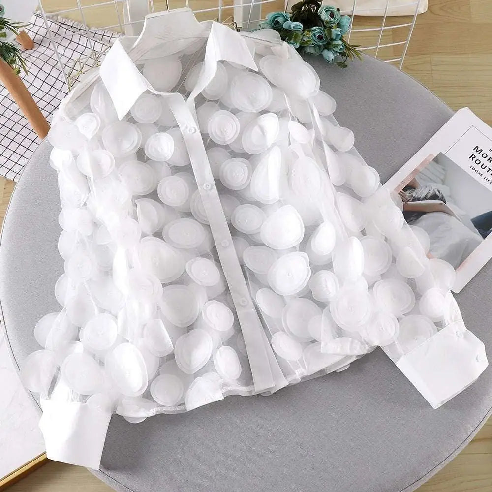 White sheer chiffon gauzy shirt with fluffy cloud-like pom-poms featuring delicate flower chiffon gauzy fabric