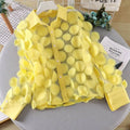 A vibrant yellow 3D flower chiffon gauzy shirt with sheer fabric and立体的圆形亮片装饰, featuring a collared long-sleeve design
