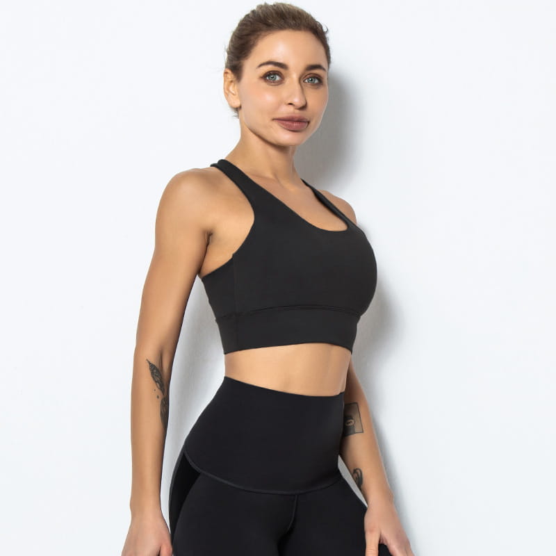 Black racerback seamless women’s shockproof running sports bra made of stretchy fabric with a supportive design for shockproof running and yoga activities.