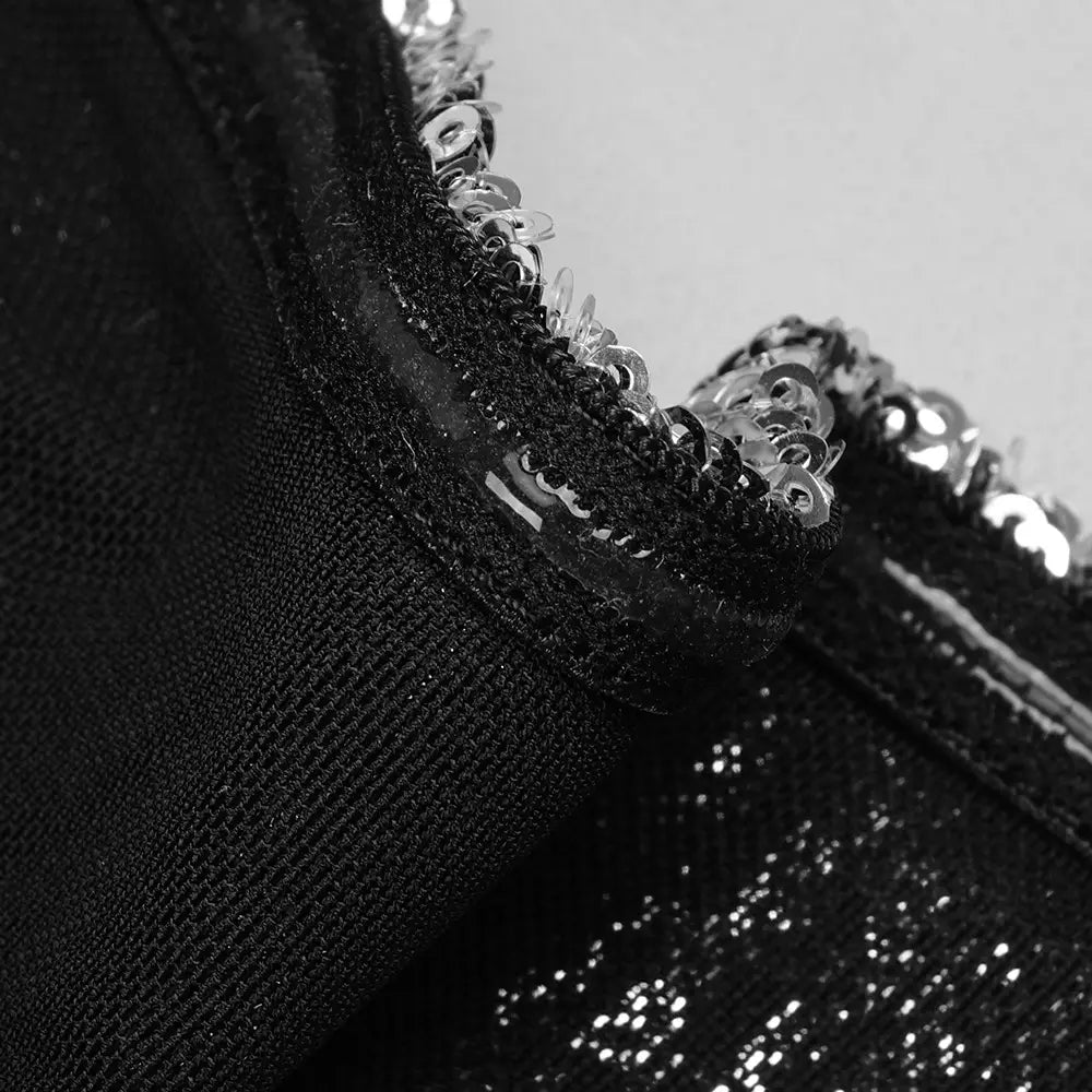black sequined collar with intricate silver embellishments on a silver strapless sequin skirt set
