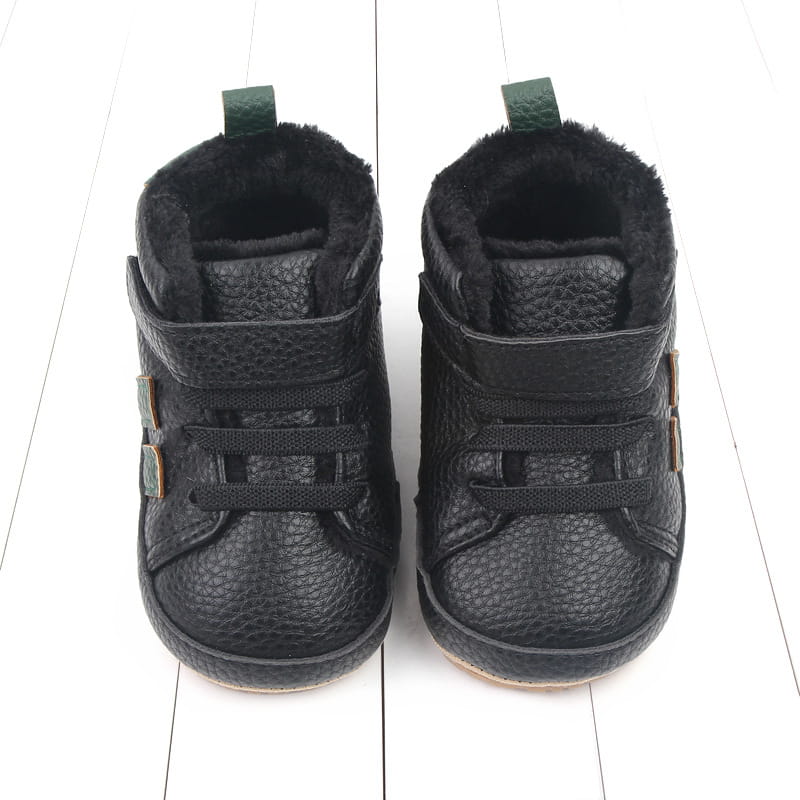 black textured leather baby shoes with plush lining and green pull tabs designed as sports soft-sole cotton shoes for comfort and flexibility