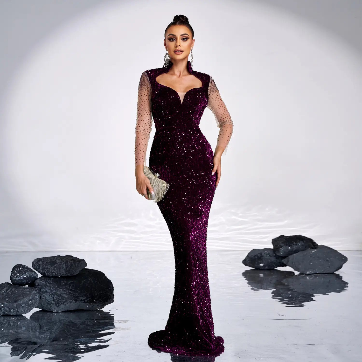 a shimmering burgundy long sleeve banquet sequined rhinestone fishtail dress with sheer sleeves and a fitted silhouette
