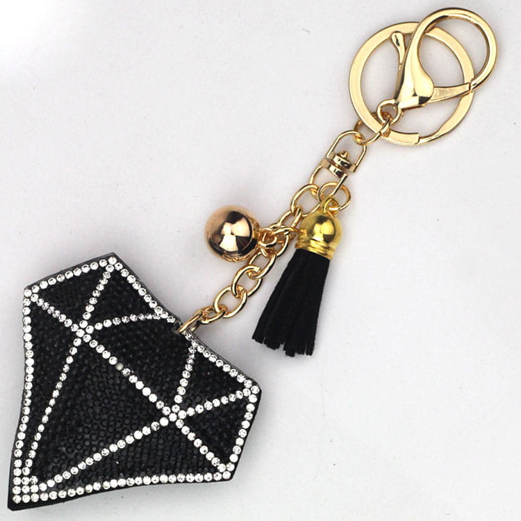 black rhinestone creative tassel bag pendant featuring a black diamond-shaped keychain with silver rhinestone detailing, gold-tone metal accents, a black tassel, and a small bell for creative tassel women’s use.