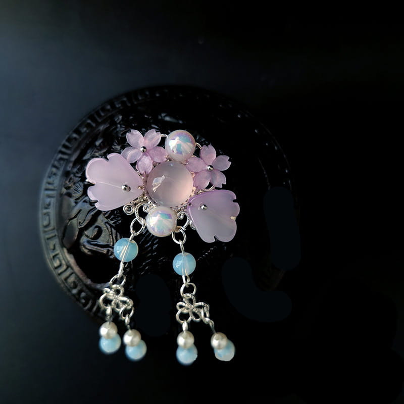 a delicate pink and light blue floral hairpin featuring silver filigree opal-like beads and dangling pearl accents as retro headgear girls accessory