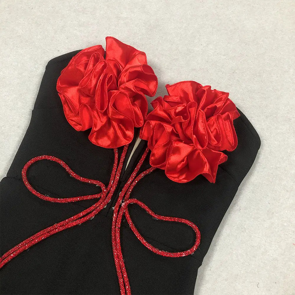 black corset from the white temperament socialite flower chain evening dress featuring two vibrant red satin ruffled flowers and a glittery red ribbon bow exemplifying style temperament socialite.