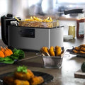 Silver and black 3l electric french fries fryer with mesh basket holding golden french fries for home use