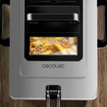 Silver Cecotec black 3L electric french fries fryer with transparent window showing golden french fries sizzling in oil