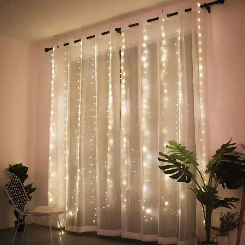 A delicate white sheer curtain with vertical warm glowing fairy lights in usb metallic christmas curtain lights 300 led