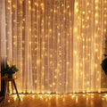 Warm golden usb metallic christmas curtain lights with 300 led on 3m x 3m sheer white backdrop for festive decor