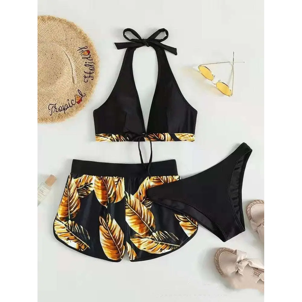 Black halter 3pcs leaf print bikini with gold leaf design and matching high waisted bottoms for summer fashion
