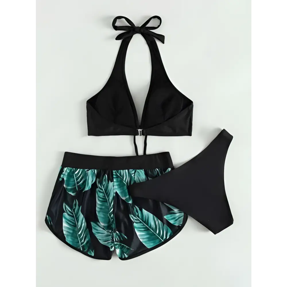 Black halter 3pcs leaf print bikini set with teal tropical leaf print shorts and solid black high-waisted bottom for summer