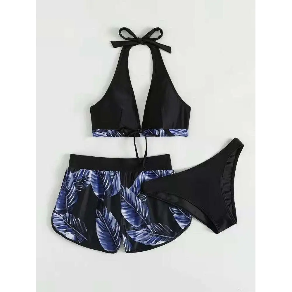 Black halter 3pcs leaf print bikini set with blue tropical leaves and matching high-waisted shorts for summer fashion